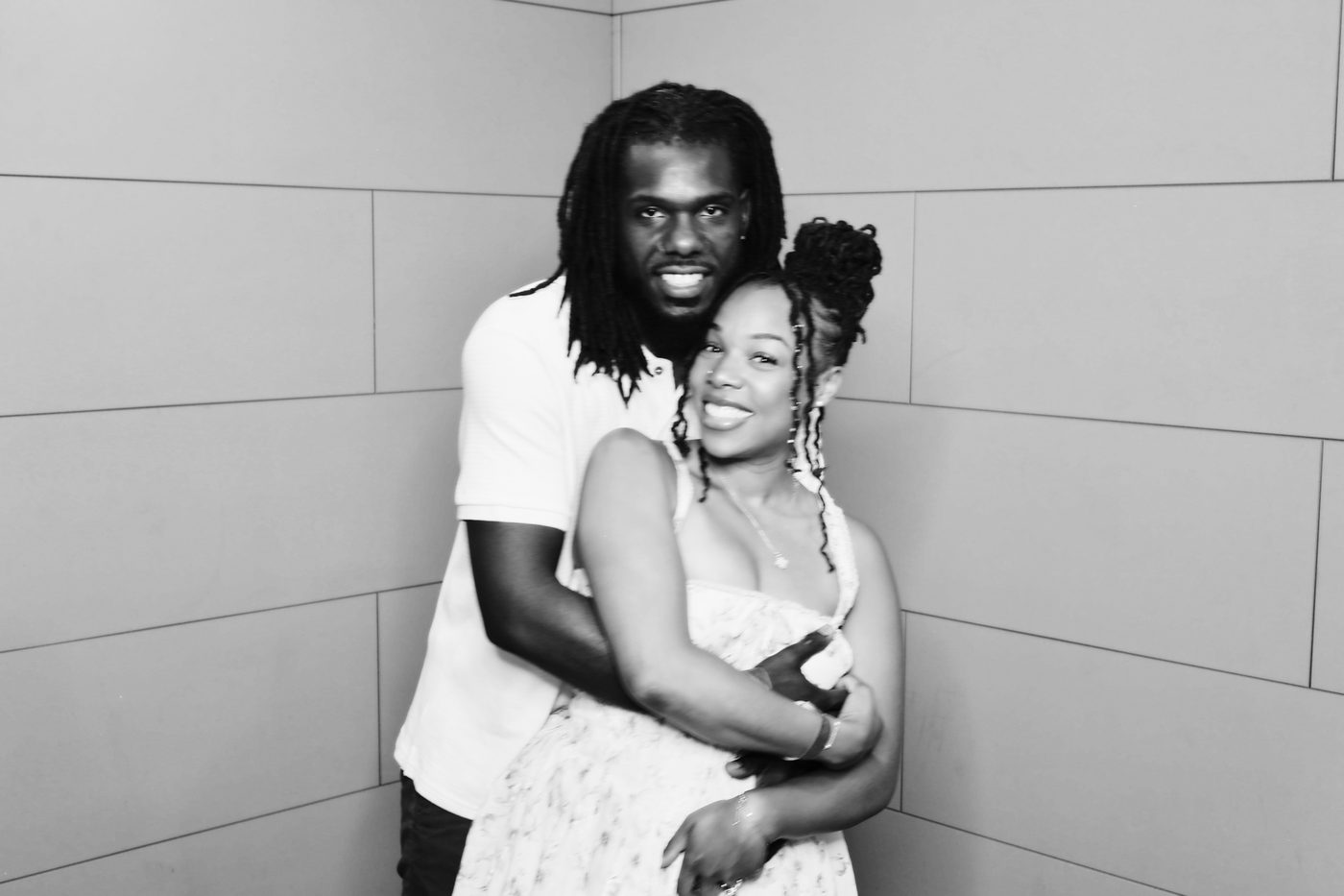 Black and white photo booth portrait of a couple