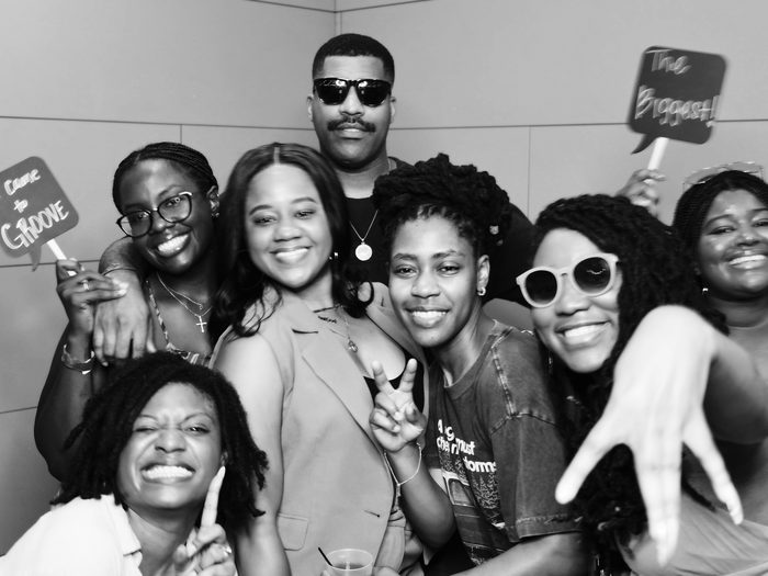 Group of friends with props at a photo booth